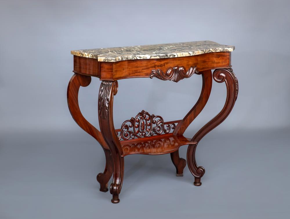 A VICTORIAN CARVED WALNUT CONSOLE TABLE of serpentine oblong form with marble top Image