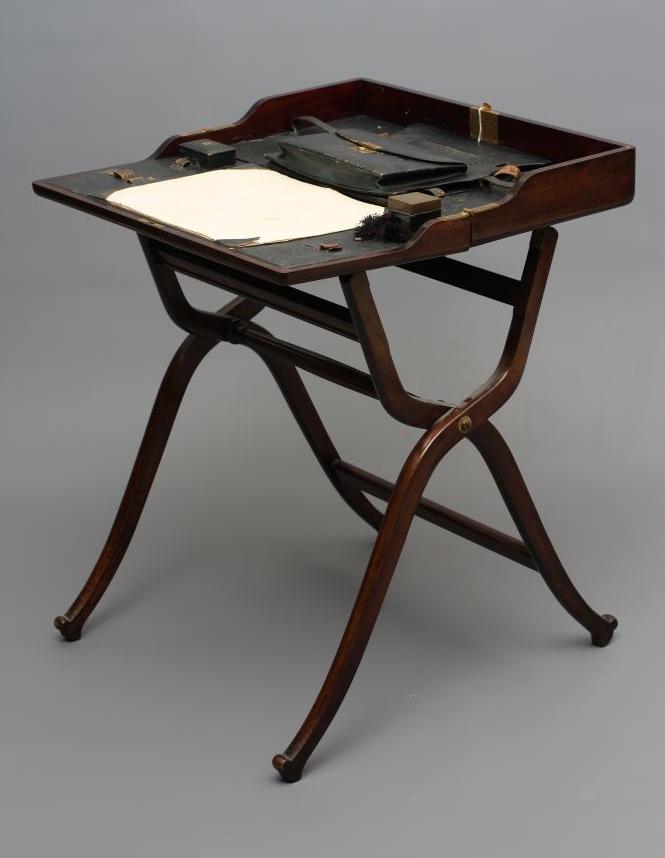 A MAHOGANY FOLDING CAMPAIGN DESK Image