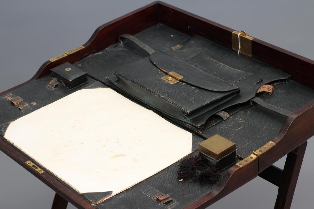 A MAHOGANY FOLDING CAMPAIGN DESK Image