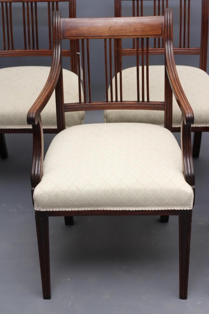 A SET OF FIVE GEORGIAN MAHOGANY DINING CHAIRS including an elbow chair Image