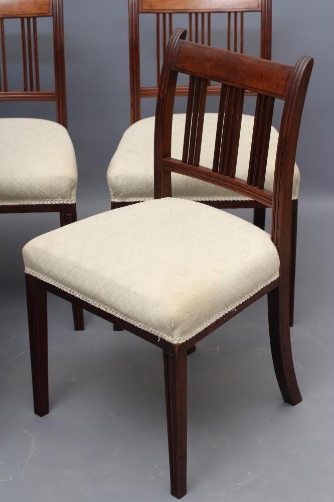 A SET OF FIVE GEORGIAN MAHOGANY DINING CHAIRS including an elbow chair Image