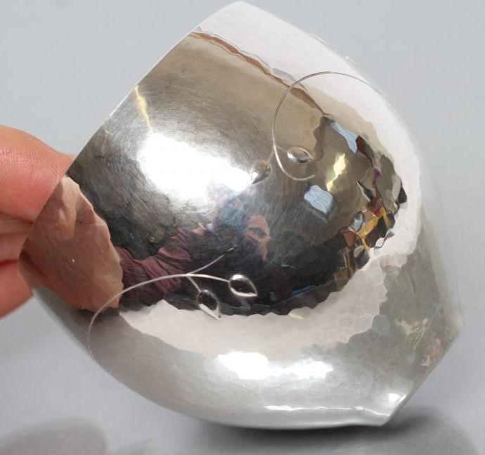 A SMALL SILVER BOWL Image