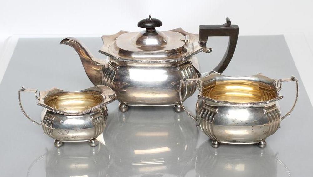 A SILVER THREE PIECE TEA SERVICE Image