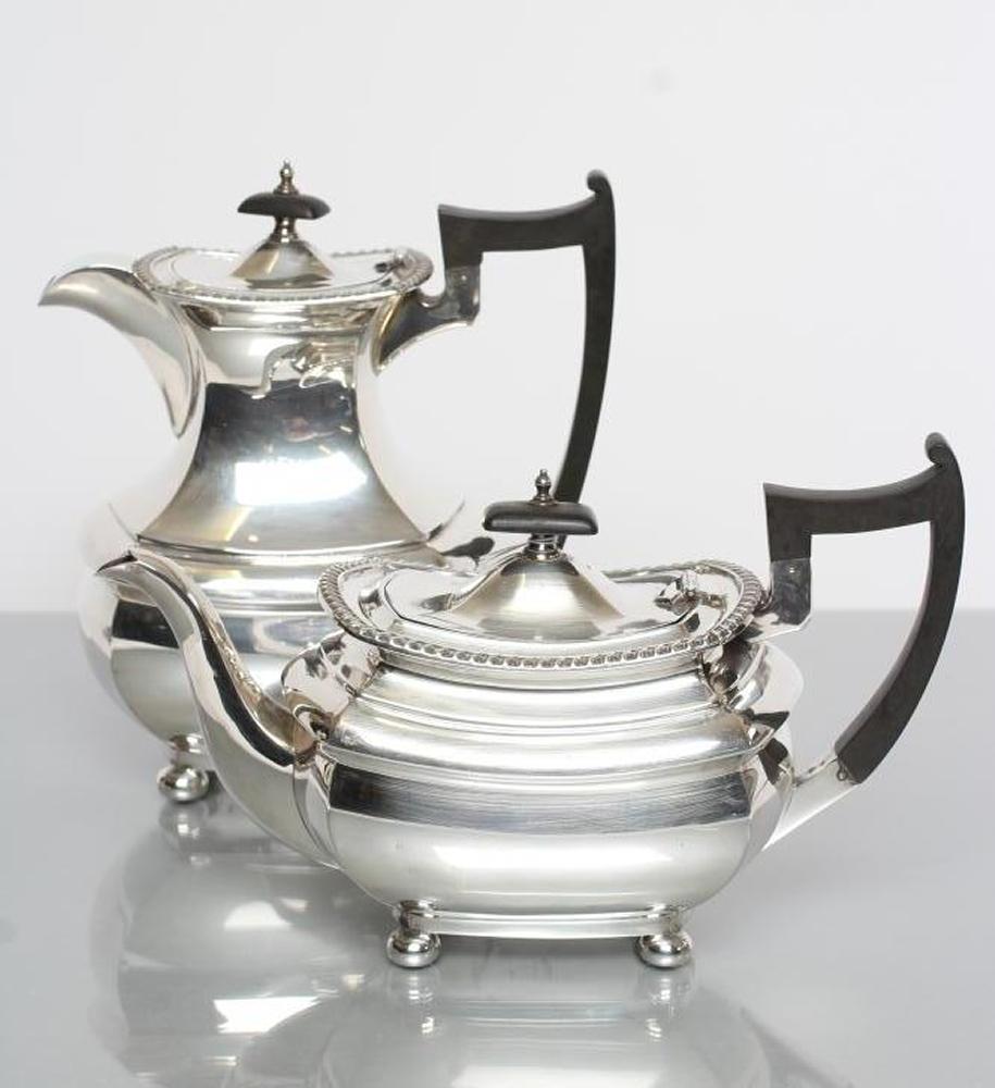 A SILVER TEA AND COFFEE POT Image
