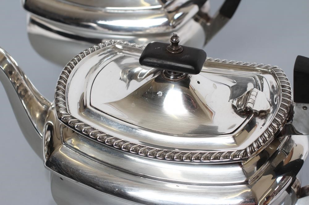 A SILVER TEA AND COFFEE POT Image