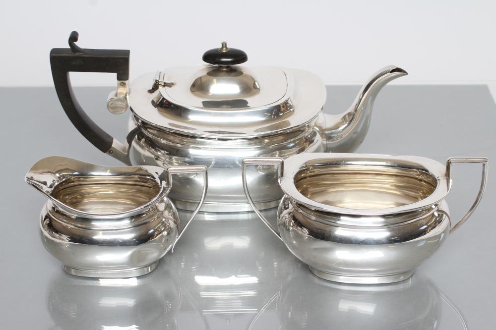 A SILVER THREE PIECE TEA SERVICE Image