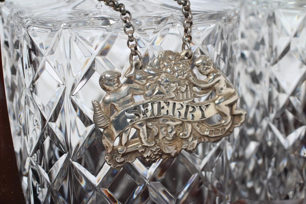 A SET OF THREE SILVER BOTTLE TICKETS Image