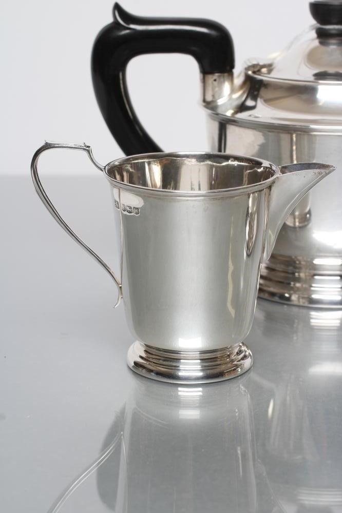 A SILVER THREE PIECE TEA SERVICE Image
