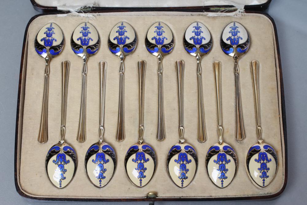 A MATCHED SET OF TWELVE SILVER GILT AND ENAMEL COFFEE SPOONS Image