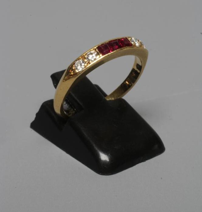 A RUBY AND DIAMOND HALF HOOP ETERNITY RING Image