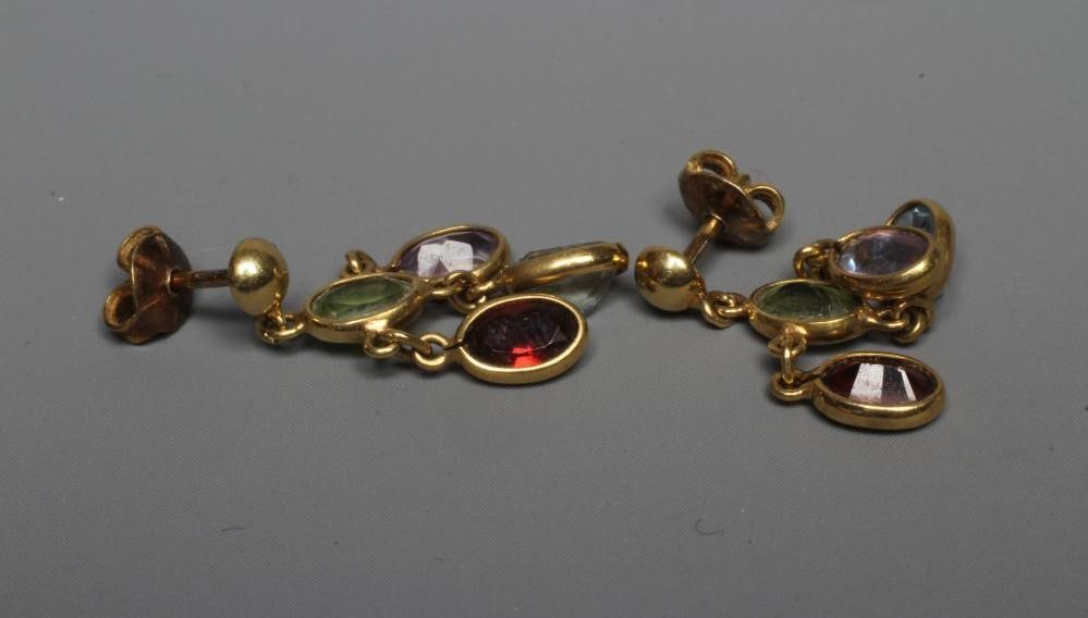 A PAIR OF MULTI-GEM CHANDELIER EARRINGS collet set with an oval facet cut aquamarine, peridot, Image