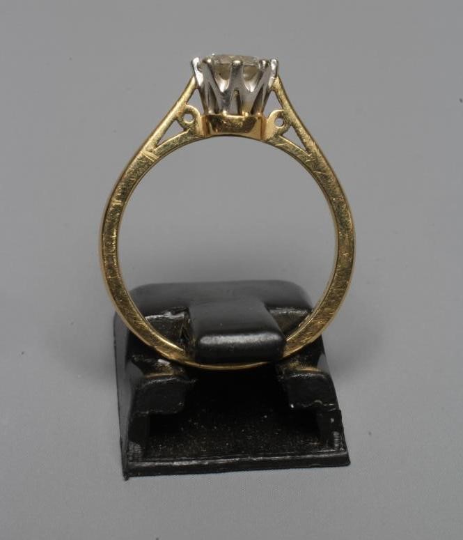 A SOLITAIRE DIAMOND RING, the brilliant cut stone of 0.50cts claw set to a plain 18ct gold shank, Image