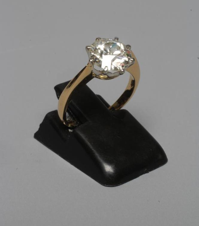 A SOLITAIRE DIAMOND RING, the brilliant cut stone of approximately 2cts, claw set to a plain Image