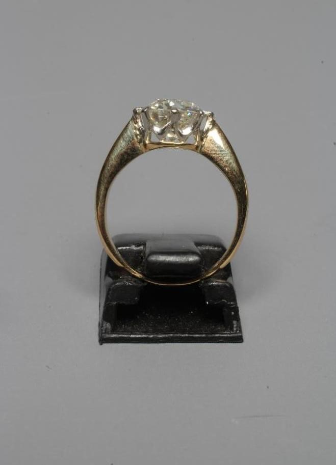 A SOLITAIRE DIAMOND RING, the brilliant cut stone of approximately 2cts, claw set to a plain Image