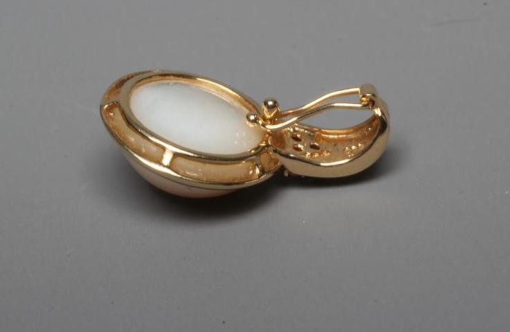 A MABE PEARL PENDANT collet set to a plain frame below a reeded bale set with three small diamonds, Image