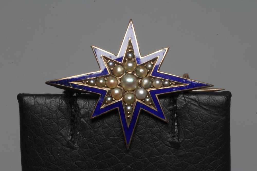 A VICTORIAN STAR BROOCH set with graduating pearls within a blue enamel border, unmarked (Est. plus Image