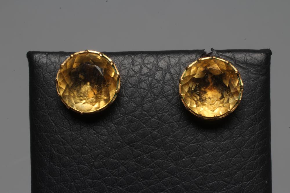 A PAIR OF LATE VICTORIAN CITRINE EAR STUDS, the circular facet cut stones collet set in plain mounts Image