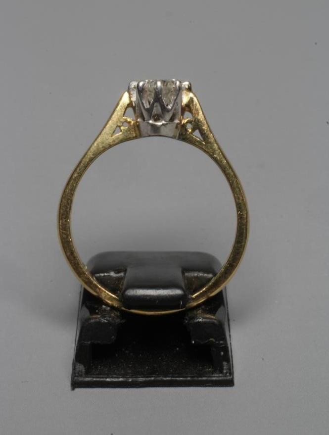 A SOLITAIRE DIAMOND RING, the brilliant cut stone of approximately 0.5cts claw set to a plain 18ct Image