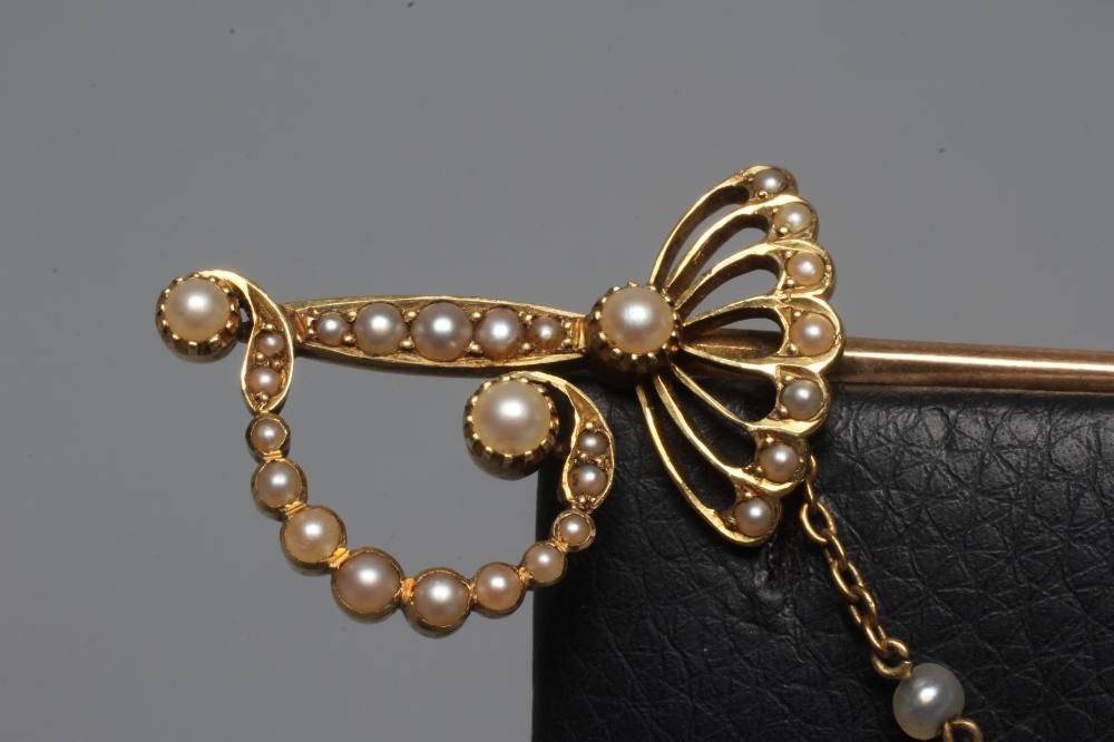AN EDWARDIAN NOVELTY JABOT PIN in the form of a court sword with seed pearl set basket hilt and Image