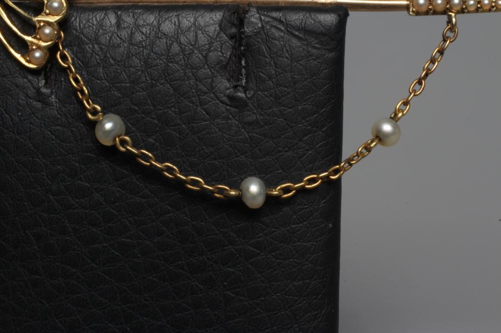 AN EDWARDIAN NOVELTY JABOT PIN in the form of a court sword with seed pearl set basket hilt and Image