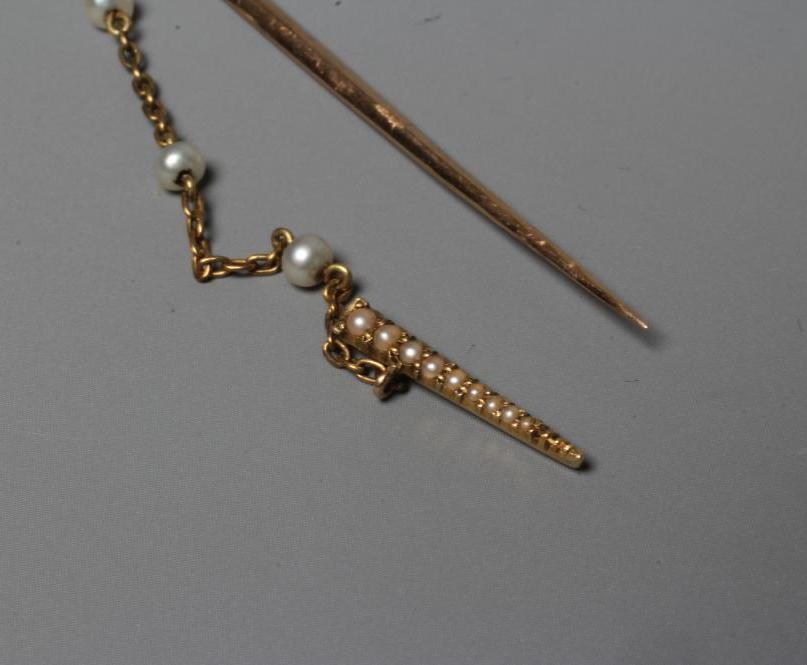 AN EDWARDIAN NOVELTY JABOT PIN in the form of a court sword with seed pearl set basket hilt and Image