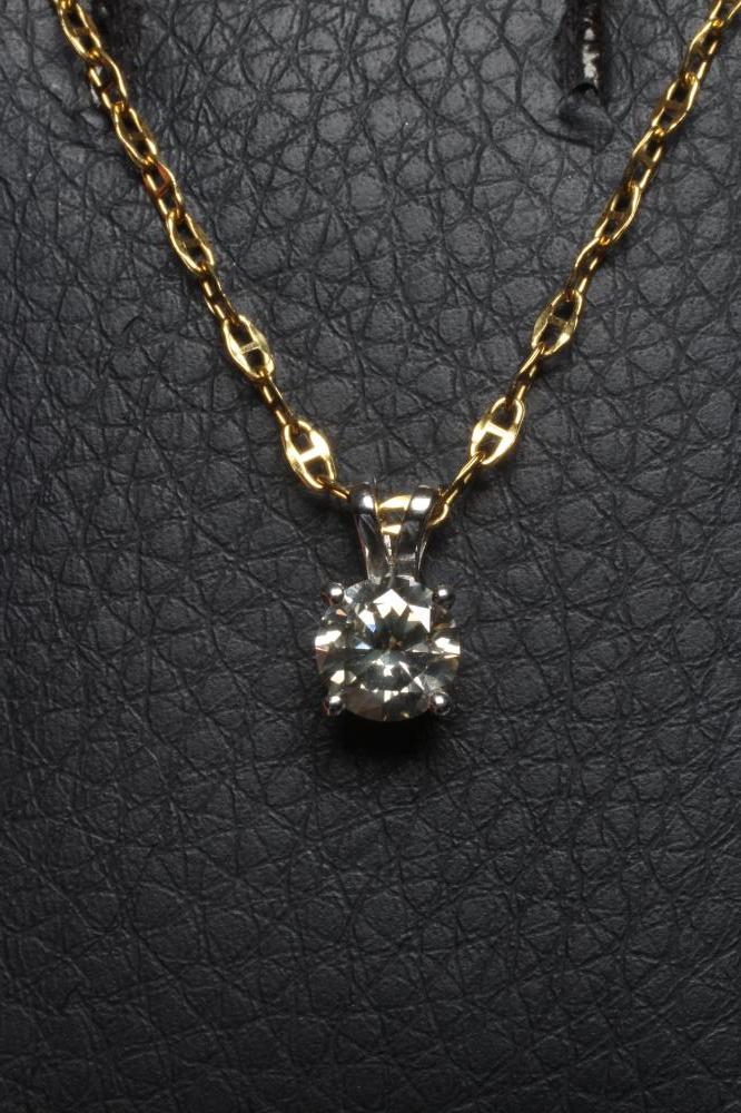 A SOLITAIRE DIAMOND PENDANT, the claw set brilliant cut stone to an 18ct gold bi-furcated bale, Image