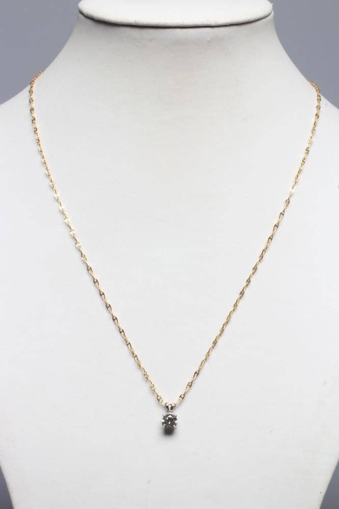 A SOLITAIRE DIAMOND PENDANT, the claw set brilliant cut stone to an 18ct gold bi-furcated bale, Image