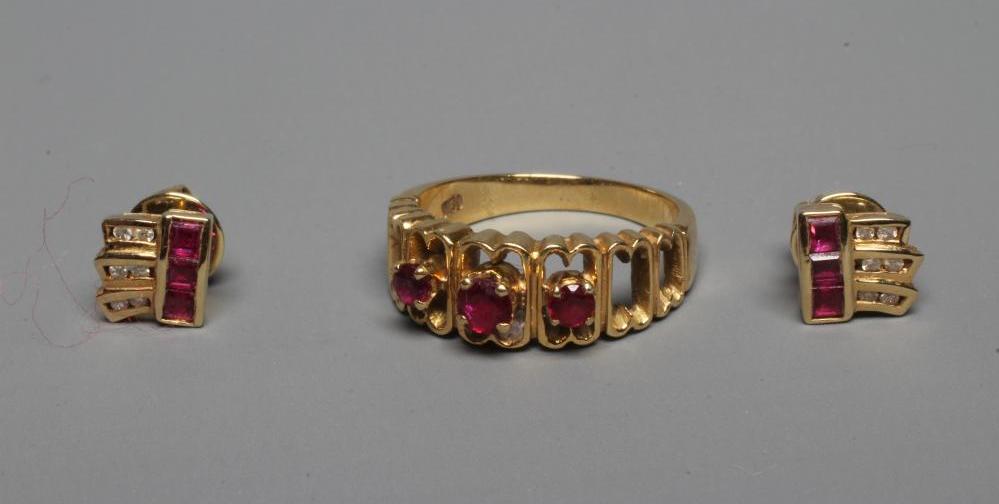 A THREE STONE RUBY RING Image