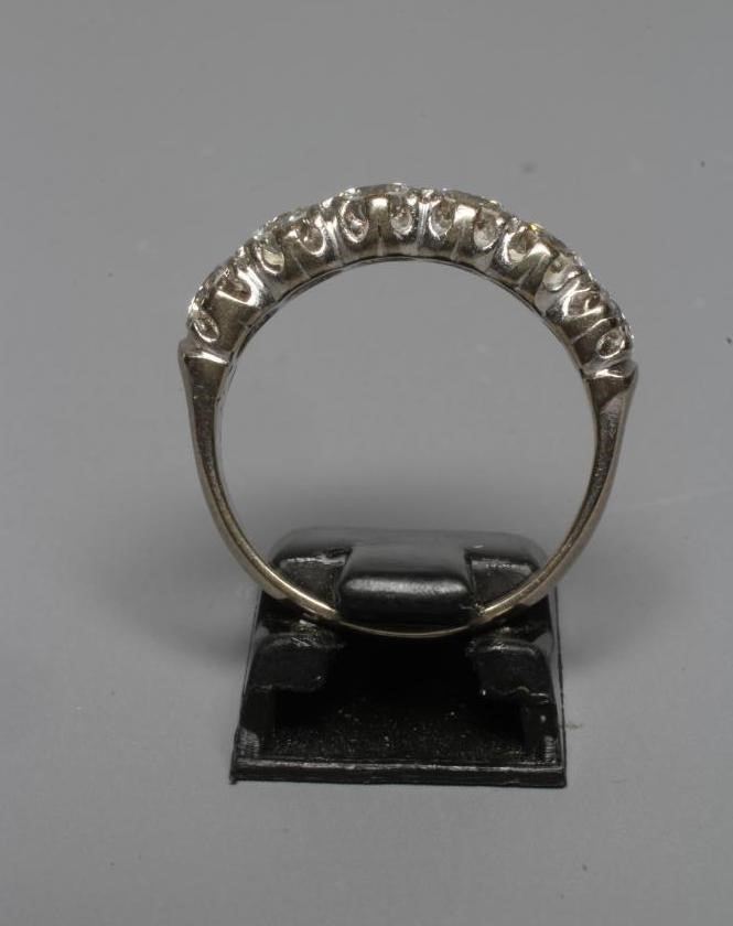 A SIX STONE DIAMOND RING, the round brilliant cut stones each of approximately 0.40cts (TCW approx. Image