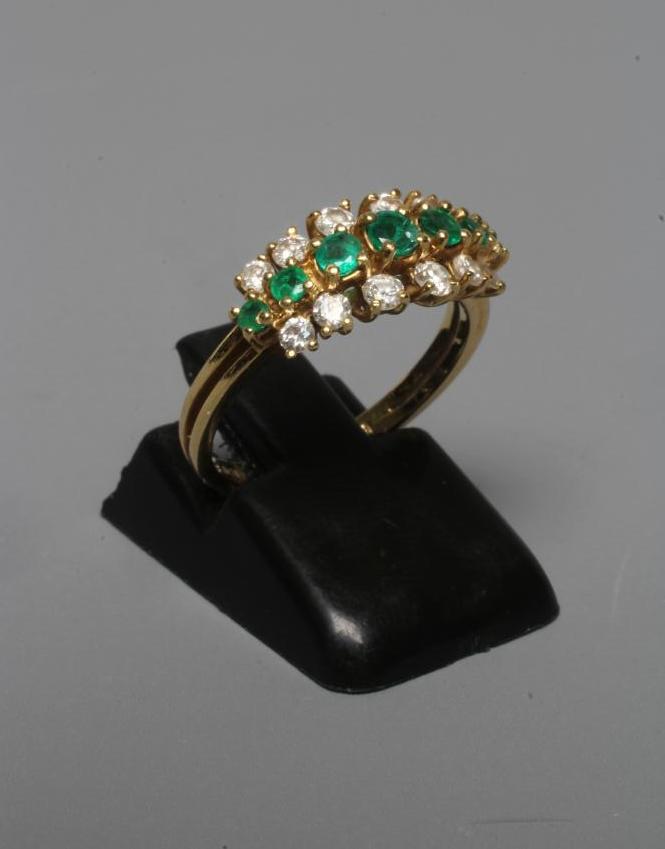 AN EMERALD AND DIAMOND RING Image