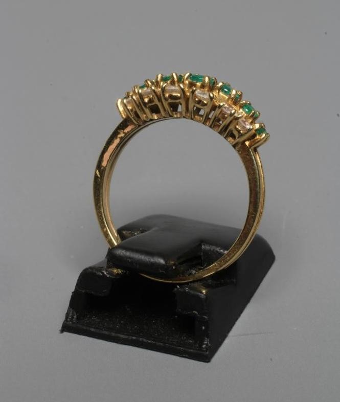 AN EMERALD AND DIAMOND RING Image
