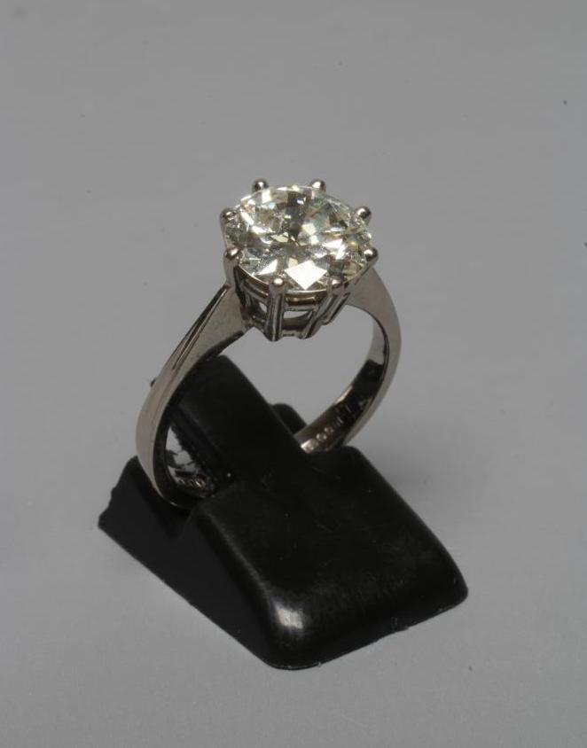 A SOLITAIRE DIAMOND RING, the brilliant cut stone of approximately 3cts, claw set to a plain 18ct Image