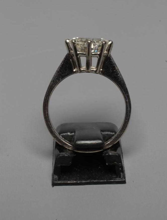 A SOLITAIRE DIAMOND RING, the brilliant cut stone of approximately 3cts, claw set to a plain 18ct Image