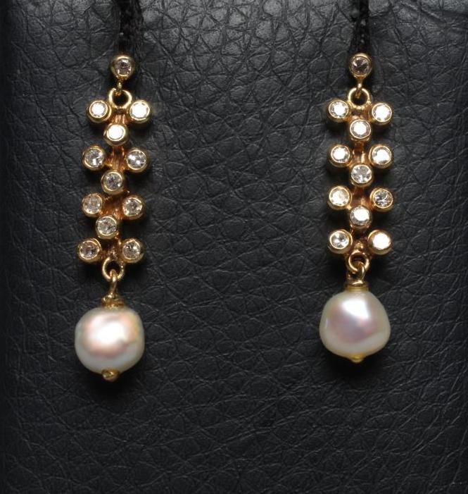 A PAIR OF DIAMOND AND FRESHWATER PEARL DROP EARRINGS, the pearls hung from a bar set with eleven Image