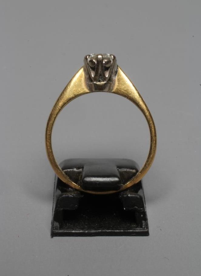A SOLITAIRE DIAMOND RING, the brilliant cut stone of approximately 0.5cts, claw set to a plain 18ct Image