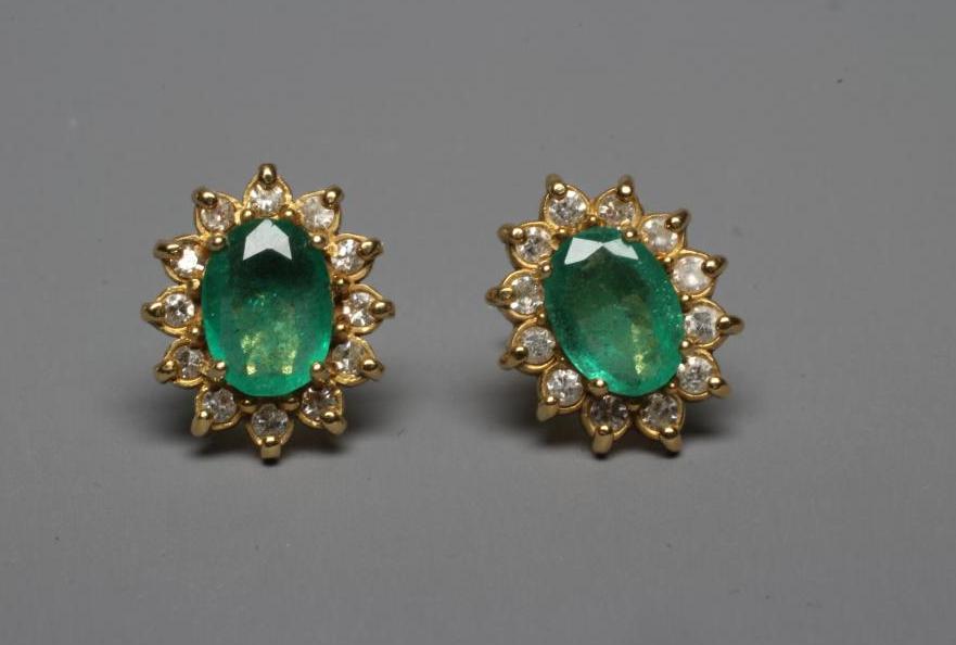 A PAIR OF EMERALD AND DIAMOND CLUSTER EAR STUDS Image
