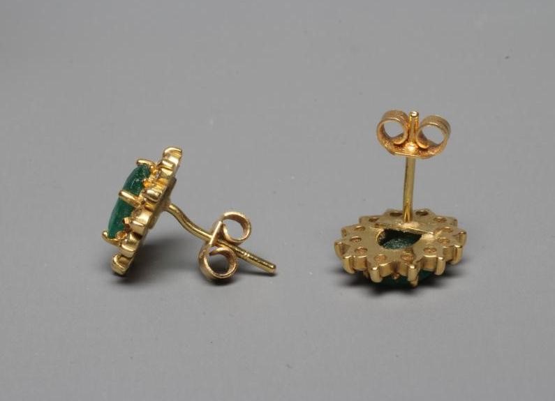 A PAIR OF EMERALD AND DIAMOND CLUSTER EAR STUDS Image