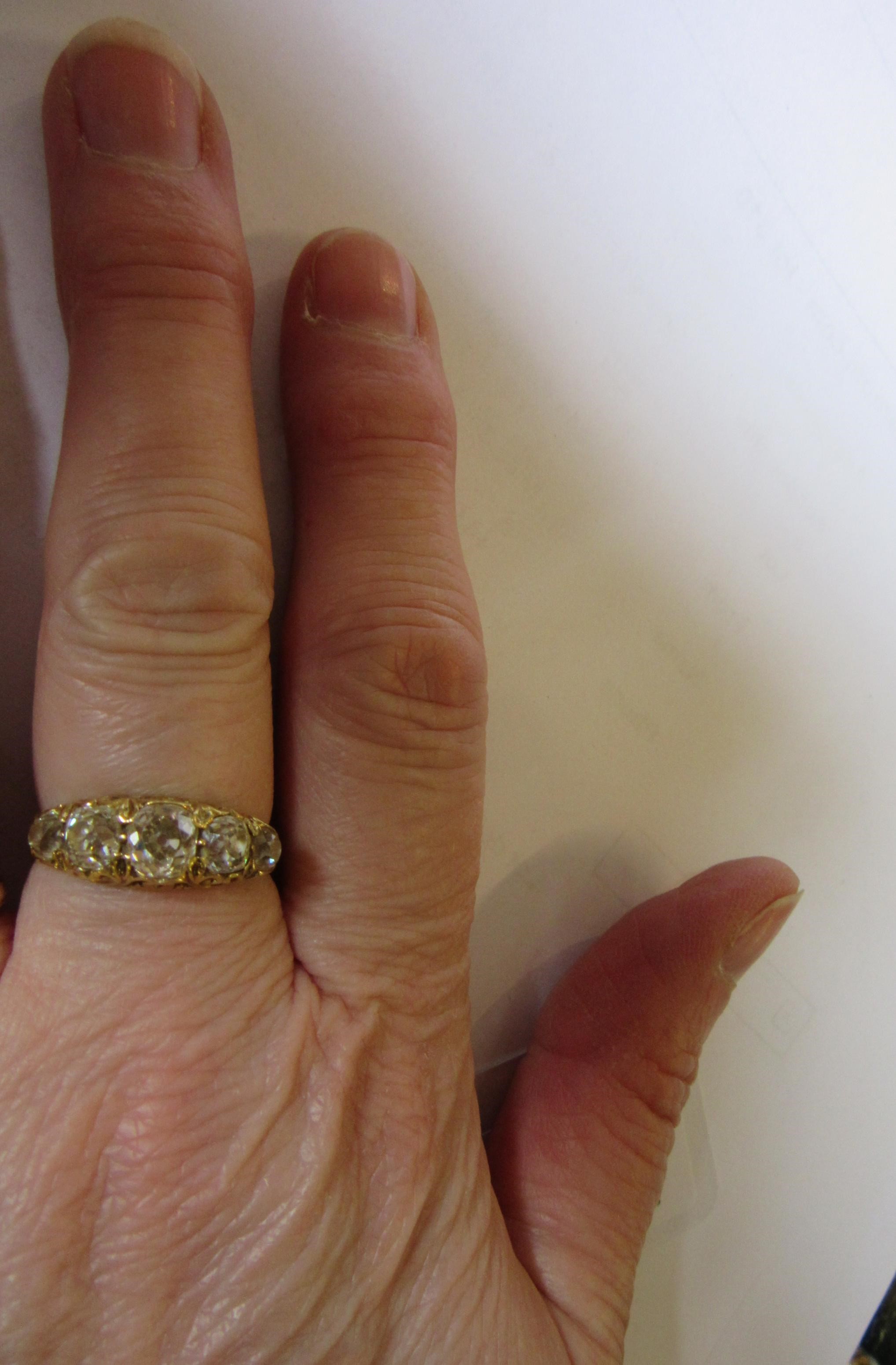 A FIVE STONE DIAMOND RING Image