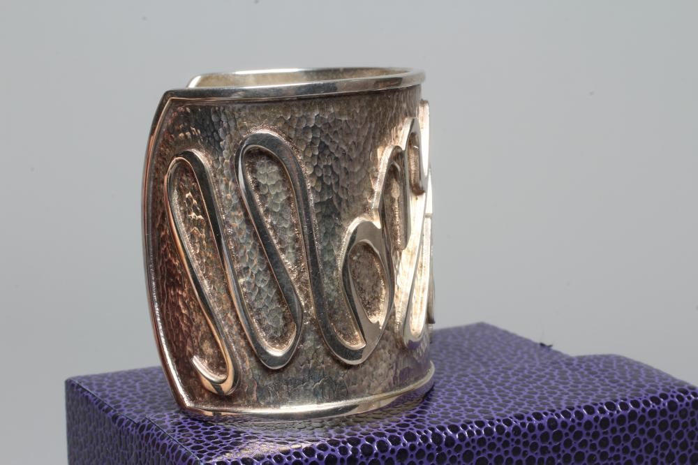A MODERN WIDE SILVER CUFF by Hamilton & Inches Image