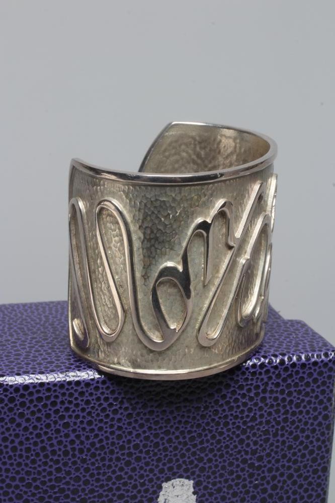 A MODERN WIDE SILVER CUFF by Hamilton & Inches Image