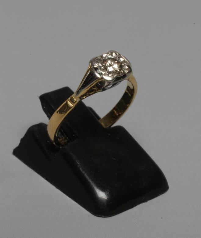 A SOLITAIRE DIAMOND RING, the brilliant cut stone of approximately 0.5cts, illusion set in a square Image
