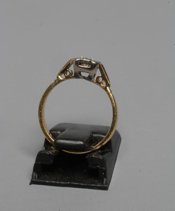 A SOLITAIRE DIAMOND RING, the brilliant cut stone of approximately 0.5cts, illusion set in a square Image