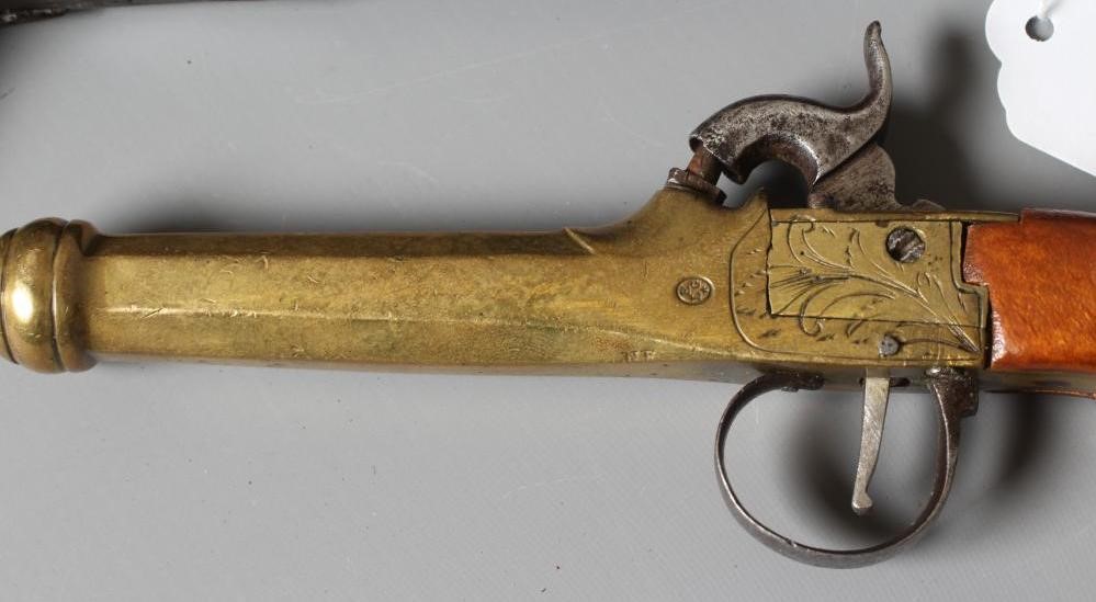 THREE ANTIQUE PISTOLS comprising a Belgian brass percussion pistol with octagonal barrel and etched Image