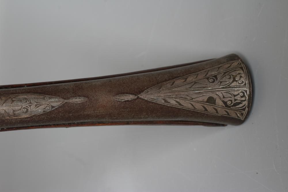 A FLINTLOCK BLUNDERBUSS PISTOL with 12" white metal inlaid barrel, carved and inlaid wood stock and Image