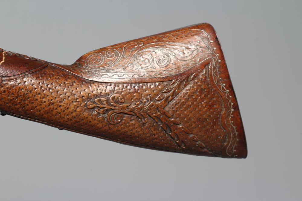 A FLINTLOCK BLUNDERBUSS PISTOL with 12" white metal inlaid barrel, carved and inlaid wood stock and Image