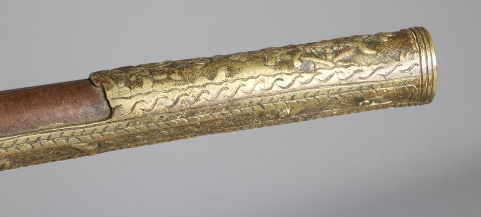 A FLINTLOCK PISTOL with 12" barrel, plain action and highly decorative foliate designed brass stock, Image