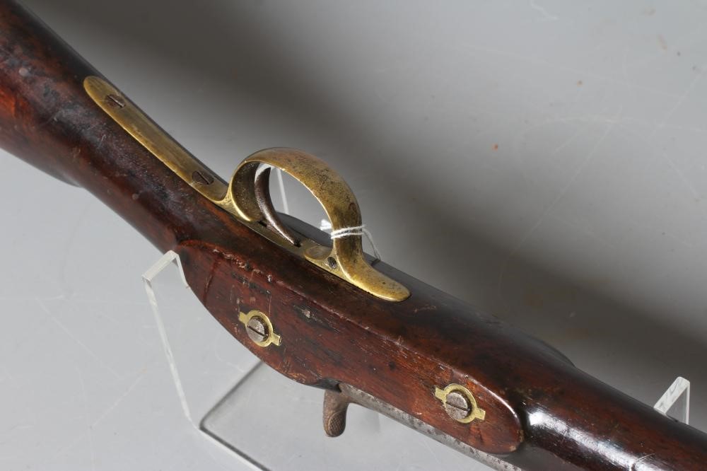 A PERCUSSION CARBINE MUSKET with 31" barrel, action bearing a crown, half length wood stock, brass Image