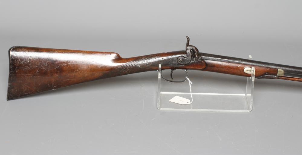 A PERCUSSION MUSKET, the 29 3/4" barrel octagonal at the breech, foliate etched action, steel Image