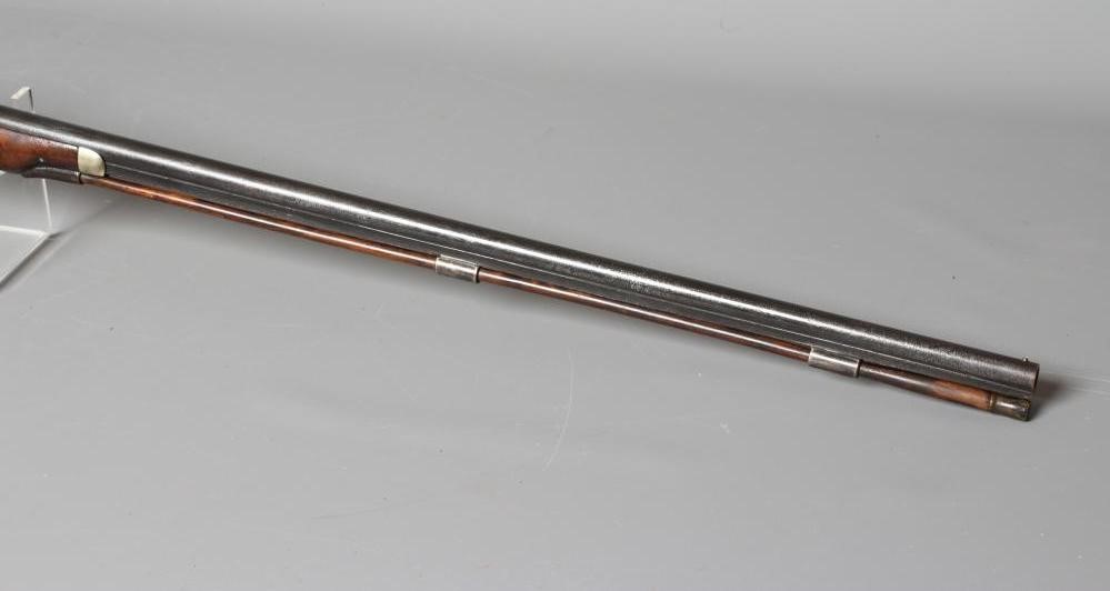 A PERCUSSION MUSKET, the 29 3/4" barrel octagonal at the breech, foliate etched action, steel Image