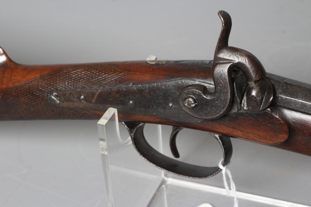 A PERCUSSION MUSKET, the 29 3/4" barrel octagonal at the breech, foliate etched action, steel Image